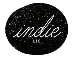 A black circle with white cursive text reading 'indie LIC'.
