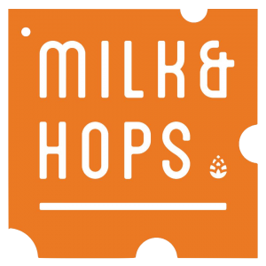 Logo of Milk & Hops with a hop cone symbol on an orange background.