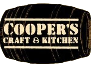 A rustic wooden barrel with 'Cooper's Craft & Kitchen' branding.