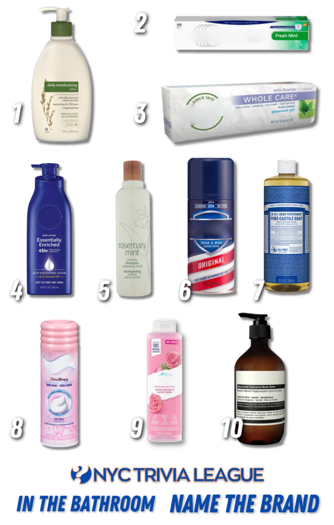 Trivia night answer sheets and pens on a wooden table.