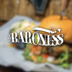 A gourmet burger with fresh toppings and a soft bun.